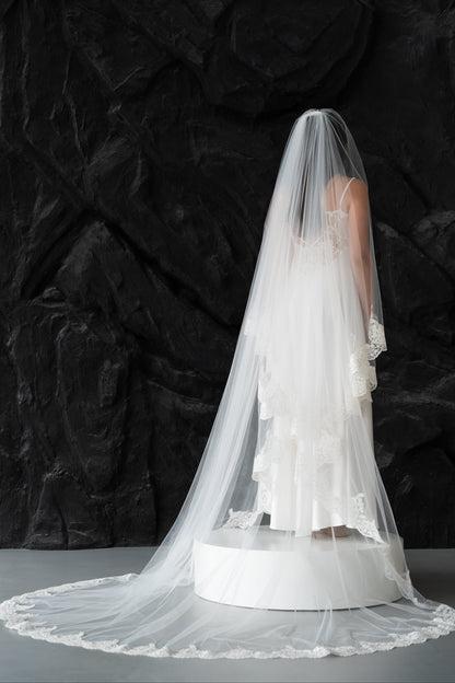 Ivory two-tier bridal veil with delicate lace trim edging